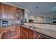 Kitchen with double sinks, granite countertops, and wooden cabinets at 1035 Cryolite Pl, Castle Rock, CO 80108