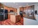 Spacious kitchen with an island, granite countertops, and wooden cabinets at 1035 Cryolite Pl, Castle Rock, CO 80108