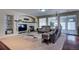 Living room with a fireplace and access to a sunroom at 1035 Cryolite Pl, Castle Rock, CO 80108