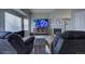 Relaxing living room with fireplace and large TV at 1035 Cryolite Pl, Castle Rock, CO 80108