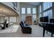 Spacious living room with high ceilings, large windows and a fireplace at 1035 Cryolite Pl, Castle Rock, CO 80108