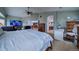 Main bedroom with ensuite bathroom and home office area at 1035 Cryolite Pl, Castle Rock, CO 80108