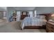 Spacious main bedroom with large bed, ensuite bathroom, and sitting area at 1035 Cryolite Pl, Castle Rock, CO 80108