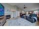 Relaxing sitting area with fireplace and two comfortable recliners at 1035 Cryolite Pl, Castle Rock, CO 80108