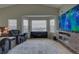 Sitting area with bay window, TV, and ample seating at 1035 Cryolite Pl, Castle Rock, CO 80108