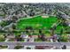 Beautiful aerial view of a neighborhood, with homes surrounding a large park and baseball diamond at 1821 E Kettle Ave, Centennial, CO 80122
