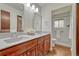 Well-lit bathroom featuring a double vanity and a walk-in shower at 1821 E Kettle Ave, Centennial, CO 80122