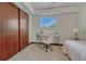 Bright bedroom featuring a desk and large closet for ample storage space at 1821 E Kettle Ave, Centennial, CO 80122