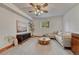 Bright living room with a modern ceiling fan, cozy couch, and stylish decor at 1821 E Kettle Ave, Centennial, CO 80122