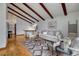 Spacious living room features wood floors, exposed beams, a comfortable sofa, and a staircase at 1821 E Kettle Ave, Centennial, CO 80122