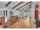 Bright living room with vaulted ceilings, exposed beams, hardwood floors, and a large window at 1821 E Kettle Ave, Centennial, CO 80122