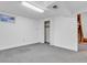 Finished basement area with neutral walls, carpet, window, closet, and doorway to utility area at 8705 W 86Th Dr, Arvada, CO 80005