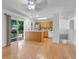 Open floor plan combining dining area and kitchen with stainless steel appliances at 8705 W 86Th Dr, Arvada, CO 80005
