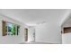 Bright and airy living space featuring hardwood floors, neutral paint, and large windows at 8705 W 86Th Dr, Arvada, CO 80005