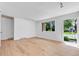 Spacious living room with hardwood floors, lots of natural light and neutral paint at 8705 W 86Th Dr, Arvada, CO 80005
