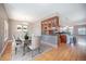 Dining room with stylish chandelier, hardwood floors, and adjacent kitchen view at 4225 W 30Th Ave, Denver, CO 80212