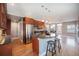 Open kitchen featuring stainless steel appliances, granite countertops, and a breakfast bar with stools at 4225 W 30Th Ave, Denver, CO 80212