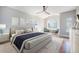 Serene main bedroom with hardwood floors, multiple windows, and ample natural light at 4225 W 30Th Ave, Denver, CO 80212