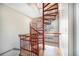 Unique interior staircase with red metal and wood construction; a striking architectural feature at 4225 W 30Th Ave, Denver, CO 80212