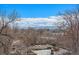 City view framed by bare tree branches, with distant mountains visible on a clear day at 4225 W 30Th Ave, Denver, CO 80212