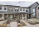 Charming townhome featuring a welcoming front patio area with seating at 9269 Garnett St # C, Arvada, CO 80007