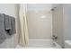 Bathtub with light-colored tiles, shower curtain, and classic fixtures at 2595 S Sheridan Blvd # 20, Denver, CO 80227