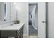 Bathroom with a gray vanity that offers modern lighting and decor at 2595 S Sheridan Blvd # 20, Denver, CO 80227