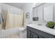 Neutral bathroom offering a shower-tub combo and a dark vanity at 2595 S Sheridan Blvd # 20, Denver, CO 80227