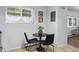 Bright dining area features a modern table set and a window with natural light at 2595 S Sheridan Blvd # 20, Denver, CO 80227