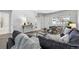 Inviting living room features a comfortable couch, lots of pillows and plenty of natural light at 2595 S Sheridan Blvd # 20, Denver, CO 80227