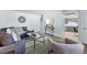 The bright living room has an open layout with stylish decor, with the kitchen off to the side at 2595 S Sheridan Blvd # 20, Denver, CO 80227