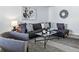 Bright living room features an open layout, comfortable couch, and stylish decor at 2595 S Sheridan Blvd # 20, Denver, CO 80227