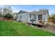 Spacious backyard features a well-maintained lawn, a cozy deck, and a privacy fence at 4312 Windmill Dr, Brighton, CO 80601