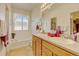 Well-lit bathroom with a dual sink vanity, soaking tub, and ample counter space at 4312 Windmill Dr, Brighton, CO 80601