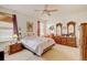 Well-appointed bedroom with windows, carpet flooring, and a stylish vanity area at 4312 Windmill Dr, Brighton, CO 80601