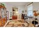 Dedicated home office space with ample storage, a comfortable desk setup, and a bright window at 4312 Windmill Dr, Brighton, CO 80601