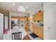 Bright eat-in kitchen with stainless appliances and a cozy dining area featuring a round table at 4312 Windmill Dr, Brighton, CO 80601