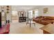 Open-concept living room with seamless flow and ample seating with access to the kitchen at 4312 Windmill Dr, Brighton, CO 80601