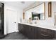 Elegant bathroom featuring double vanity, marble tile, and modern fixtures at 3112 Braun Ct, Golden, CO 80401