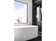 Bright bathroom with a modern tub, shower, and luxurious fixtures at 3112 Braun Ct, Golden, CO 80401