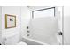 Clean bathroom features white tile, modern fixtures, and soaking tub with shower at 3112 Braun Ct, Golden, CO 80401