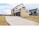 Spacious two-car garage with a concrete driveway and modern design at 3112 Braun Ct, Golden, CO 80401