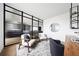 A modern office includes a glass divider, hardwood floors, and comfortable seating at 3112 Braun Ct, Golden, CO 80401