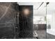 Elegant bathroom showcasing marble tiled walk-in shower with glass enclosure at 3112 Braun Ct, Golden, CO 80401