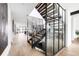 Modern staircase features glass enclosure, wood treads, and sleek metal railing at 3112 Braun Ct, Golden, CO 80401