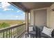 Relaxing balcony with comfortable chairs and table, providing a peaceful outdoor space with scenic views at 23376 E 5Th Pl # 201, Aurora, CO 80018