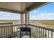Balcony featuring black grill and scenic views of the surrounding landscape and neighborhood at 23376 E 5Th Pl # 201, Aurora, CO 80018