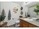 Bathroom with modern fixtures including a vanity with solid surface countertop, and decorative shelving at 23376 E 5Th Pl # 201, Aurora, CO 80018
