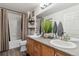 Bathroom featuring double sinks, a large mirror, and shower-tub combination at 23376 E 5Th Pl # 201, Aurora, CO 80018
