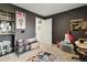 Bedroom with grey walls and a gaming setup including a custom chair and anime related decor at 23376 E 5Th Pl # 201, Aurora, CO 80018